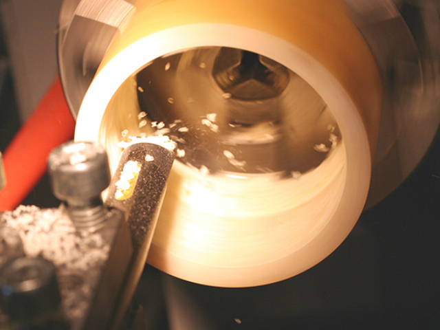 A bracelet on a lathe at Mark Davis' factory space.