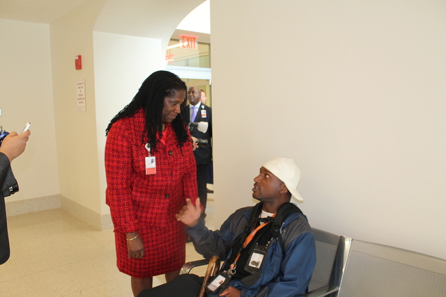 Harlem Hospital Center Executive Director Denise Soares speaks with aguest inside the new art gallery.
