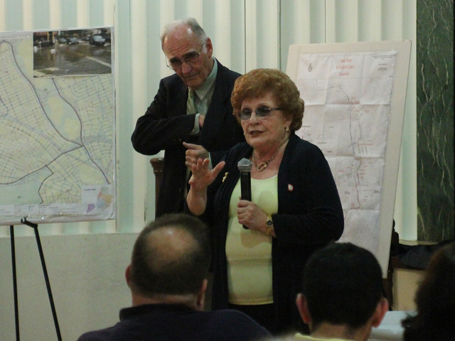 City councilwoman Karen Koslowitz tries to calm the crowd at a Town Hall at the Forest Hills Jewish Center of Sept. 27, 2012.