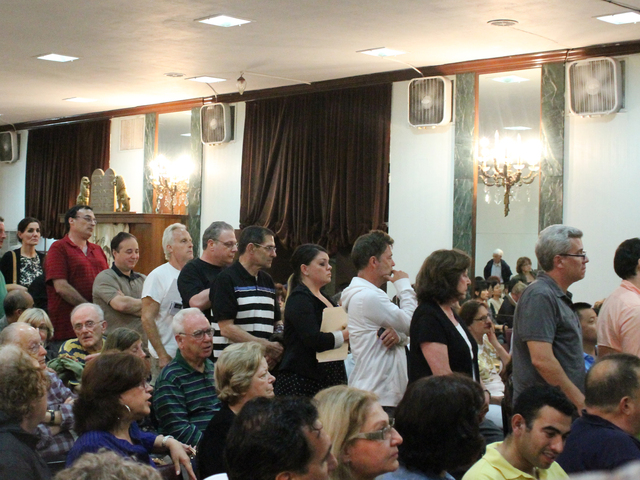 Resident line up to speak at a Town Hall at the Forest Hills Jewish Center of Sept. 27, 2012.
