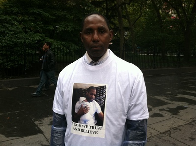 <p>Ibrahim Bah, cousin of Mohamed Bah, says that he family printed 200 t-shirts with his cousin's image and the words "in God we trust and believe."</p>
