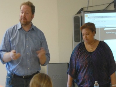 <p>Bryan Davis, chairman of the District 6 CEC's zoning committee, left, with Belkis Poche, the CEC's treasurer, at a meeting Oct. 11, 2012.</p>
