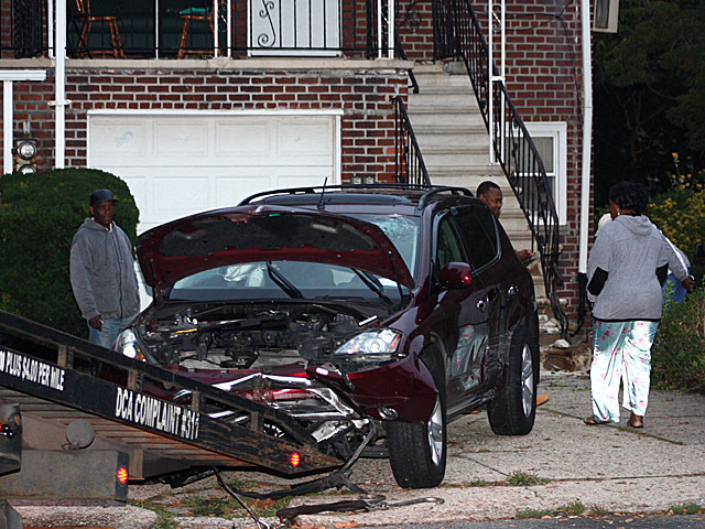 <p>Both the vehicle and the stairs were seriously damaged when an SUV slammed into a home in Canarsie on Oct. 8, 2012.</p>
