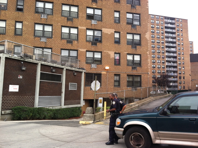 <p>Police guard the apartment building where Noel Polanco lived in Queens to keep press away after Polanco was fatally shot by a police detective on Oct. 4, 2012.</p>
