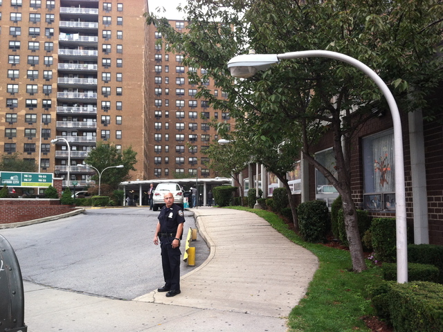 <p>Police guard the apartment building where Noel Polanco lived in Queens to keep press away after Polanco was fatally shot by a police detective on Oct. 4, 2012.</p>
