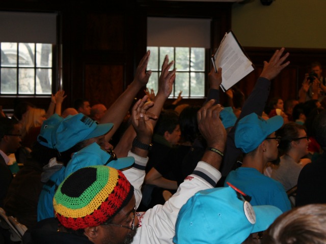 Supporters of the reforms raised their hands and waved their fingers to express their support for the bills. Cheering is prohibited during hearings.
