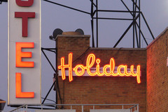 <p>A man and a woman were shot outside the Holiday Motel on October 13, 2012. A photo of the Holiday Motel sign at dusk, December 2008.</p>
