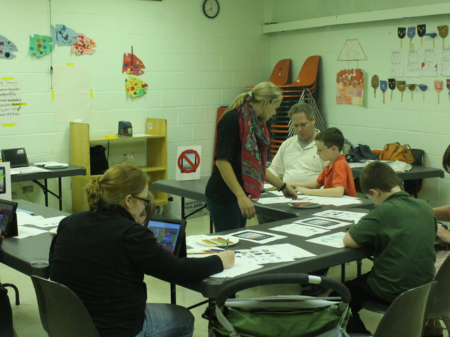 <p>Children work on stories during the Autism Initiatives iPad storytelling class at the Forest Park Library on Oct. 1, 2012.</p>
