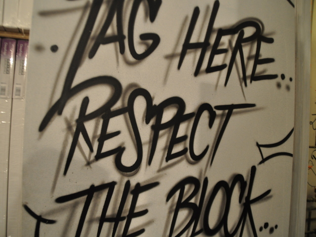 <p>Low Brow's bathroom door encourages patrons to tag the bathroom walls.</p>

