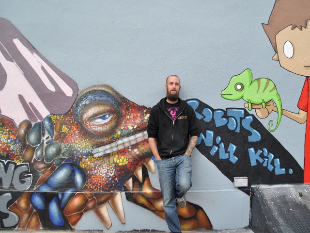 <p>Low Brow's outside wall has a rotating display of street art.</p>
