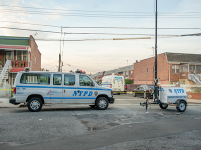 <p>Police at the scene of a fatal shooting on Hemlock Street on Oct. 22, 2012.</p>
