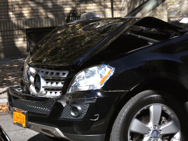 <p>A Mercedes Benz SUV crashed into the back of a school bus in Astoria, Queens, on Oct. 16, 2012.</p>
