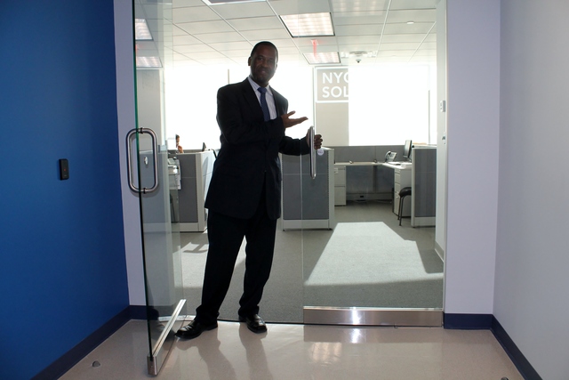 <p>Paul Smith, director of the NYC Business Solutions Center in the Bronx, shows off the new Fordham Road space. They were previously located in the south Bronx.</p>
