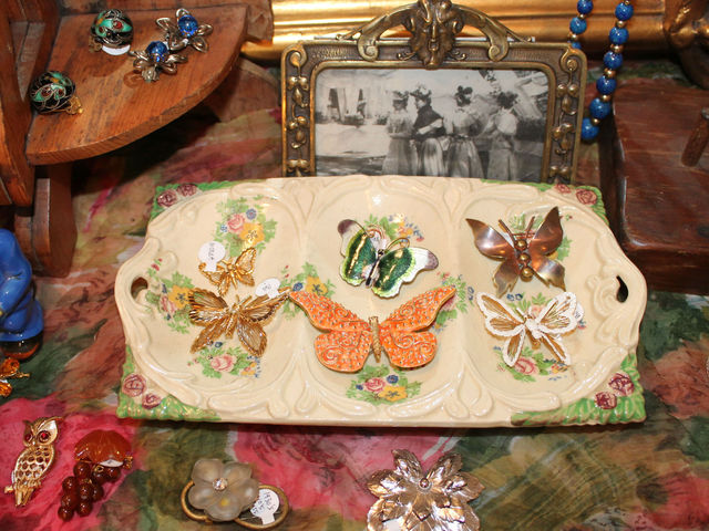 A collection of butterfly pins at Pippin.