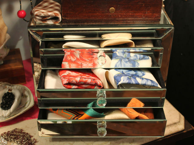 <p>Silk scarves in a vintage jewelry box.</p>
