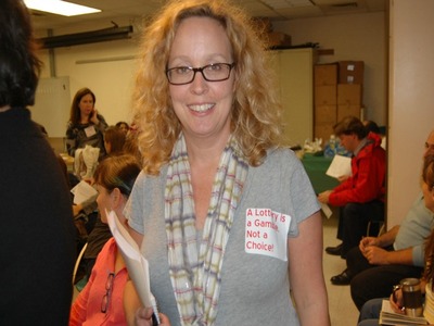 <p>Shannon Treusch Goss, an Uptown parent, wore a sticker opposing the new elementary school choice proposal at a meeting of the District 6 Community Education Council Oct. 18, 2012.</p>
