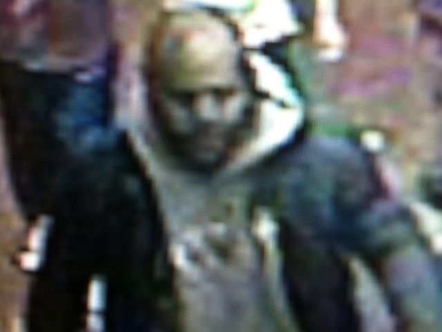 <p>A man wearing a grey sweatshirt and black jacket is suspected in the October 18, 2012 death of a Metro PCS worker in Hamilton Heights, police said.</p>
