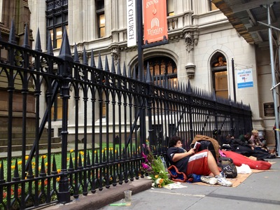 <p>People on the sidewalk outside Trinity Church on Monday, Oct. 15, 2012.</p>
