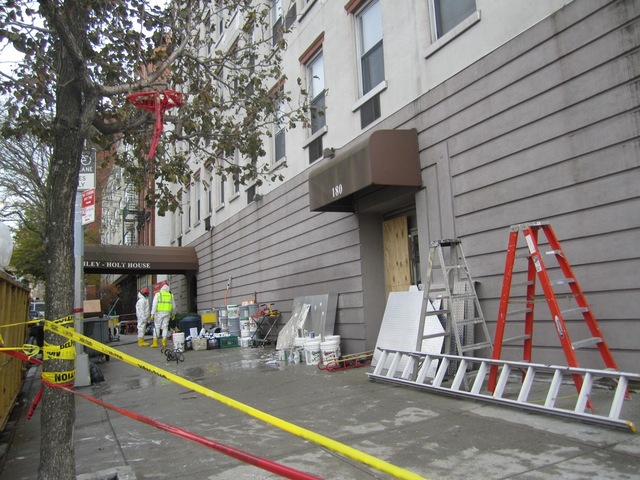 <p>Workers hauled debris out of the Bailey-Holt House Nov. 15, 2012.</p>
