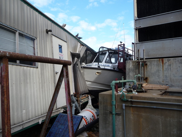 <p>A police boat washed ashore on Ellis Island during Hurricane Sandy, wedging itself between a cooling station and a trailer.</p>
