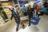 Black Friday Draws Tens of Thousands of Shoppers Hunting for Bargains