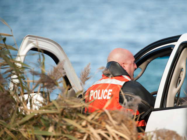 <p>Police look inside the pickup truck Monday morning, Nov. 19, 2012.</p>

