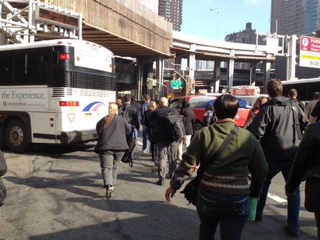 <p>Commuters walked out of the Lincoln Tunnel after a pair of buses crashed inside the tunnel during the early morning rush hour, Nov. 12, 2012.</p>
