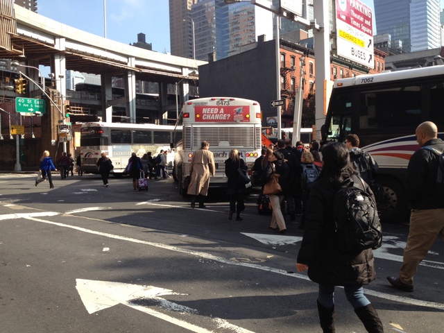 <p>Commuters walked out of the Lincoln Tunnel after a pair of buses crashed inside the tunnel during the early morning rush hour, Nov. 12, 2012.</p>
