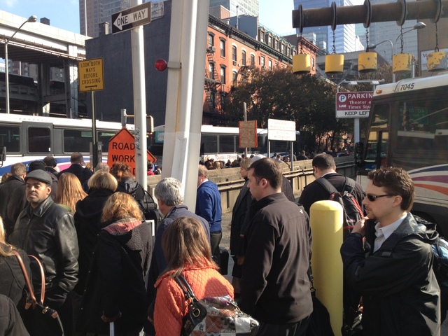 <p>Commuters walked out of the Lincoln Tunnel after a pair of buses crashed inside the tunnel during the early morning rush hour, Nov. 12, 2012.</p>
