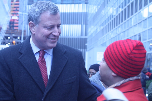 <p>Public Advocate Bill DeBlasio talks to a coprorate&nbsp;dining hall worker during a rally for paid sick days on Nov. 24, 2012.</p>
