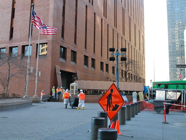 <p>Workers in white hazmat suits did repair work at 4 New York Plaza on Wednesday, Nov. 21. The building is home to the offices of the New York Daily News and JP Morgan.</p>
