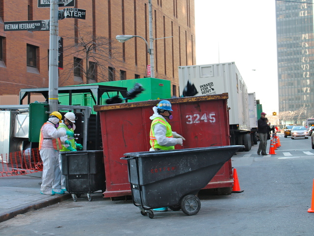<p>Workers in white hazmat suits did repair work at 4 New York Plaza on Wednesday, Nov. 21.</p>
