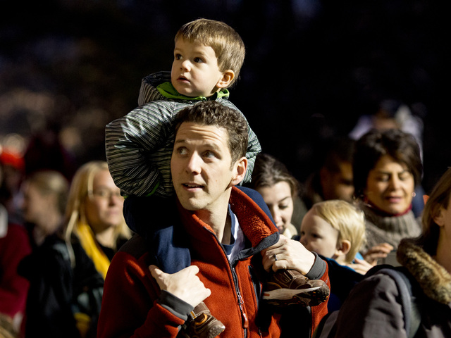 <p>A father and son enjoy the Macy's Thanksgiving Day balloon blown-up on Nov. 21st, 2012.</p>
