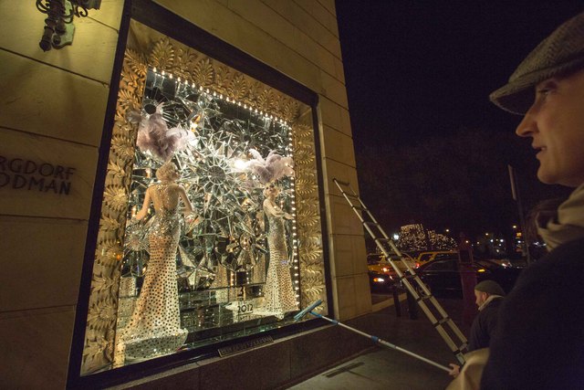<p>Staffs at Bergdorf Goodman's put some final touch on its windows before the unveiling on Nov. 20</p>
