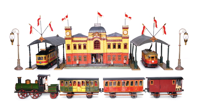 <p>A Rock &&nbsp;Graner&nbsp;train station from 1900 and a Ludwig Lutz Company toy train set from 1882.</p>
