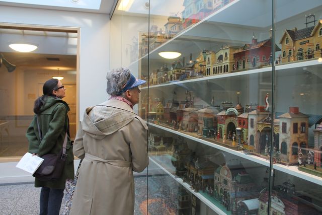 <p>Visitors sneak a peak at the Jerni Collection.</p>
