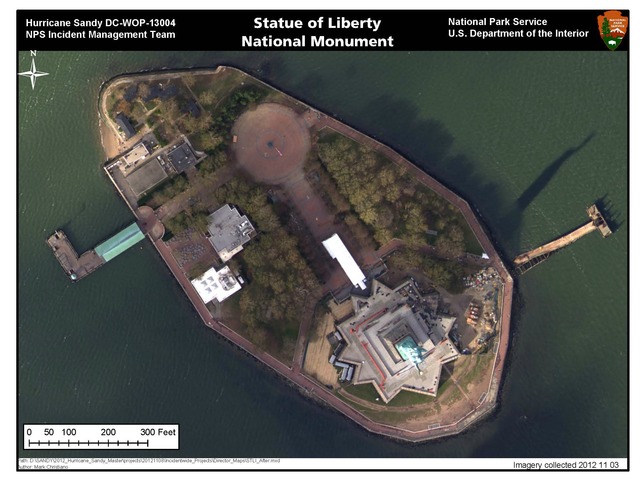 <p>A photo of Liberty Island after Sandy shows damage to the grounds including the dislodged pier in the right corner.</p>
