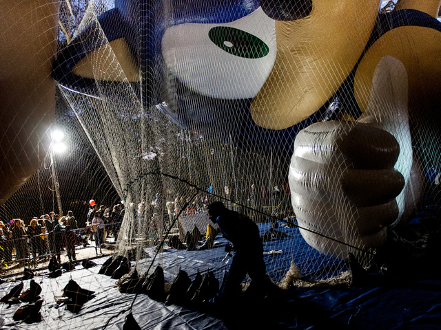 <p>A Macy's balloon technician prepares one of the giant inflatabile balloons for the annual Thanksgiving Day Parade.</p>
