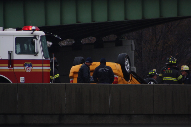 <p>A taxi overturned on a ramp leading from the Van Wyck Expressway to the Long Island Expressway Nov. 27, 2012.</p>

