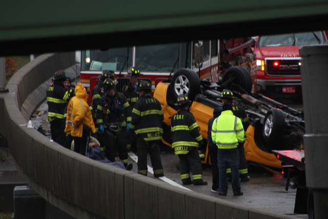 <p>A taxi flipped over in a single-car crash on a ramp leading to the Long Island Expressway in Queens Nov. 27, 2012.</p>
