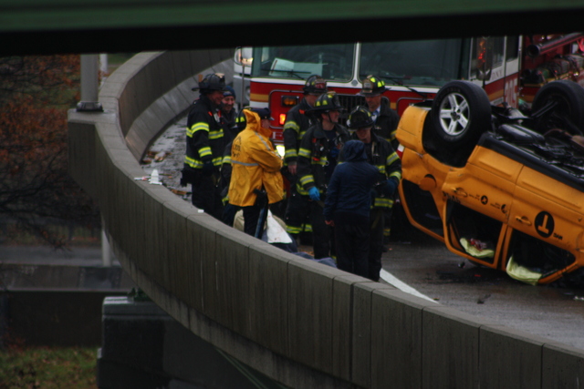 <p>A taxi flipped over on a ramp leading to the Long Island Expressway, injuring two people, Nov. 27, 2012.</p>
