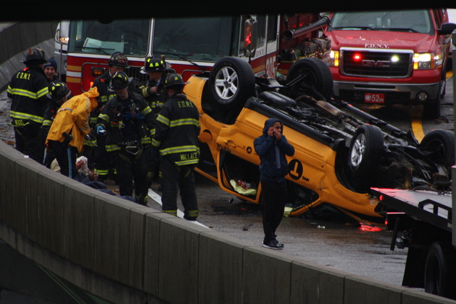 <p>A taxi flipped over on a ramp leading to the Long Island Expressway Nov. 27, 2012.</p>
