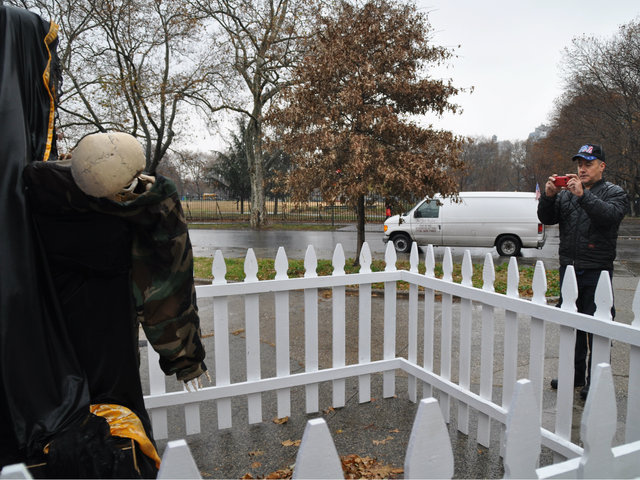 <p>Army veteran Eddie Algarin&nbsp;stopped to take pictures of the sculpture when he noticed it on Tuesday, Nov. 27, 2012.</p>
