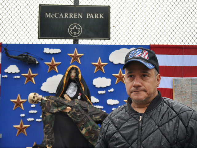 <p>Army veteran Eddie Algarin reflected in front of a sculpture mimicking the "Pieta" on the edge of McCarren Park on Tuesday, Nov. 27, 2012. Algarin said the art work, which drew on Christian and national symbols, made him "sad" and that he was not sure what to think of its placement.</p>
