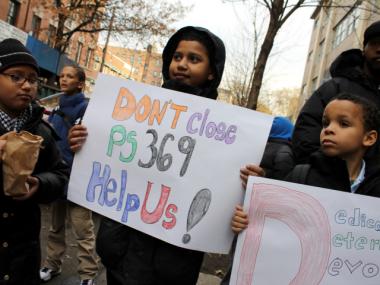 Parents and students rallied in Mott Haven Thursday outside P.S. 369, which the DOE could close.