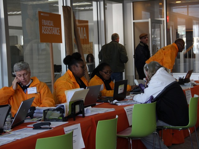 <p>Workers helping Staten Islanders at a Dongan Hills car-dealership-turned-restoration-center on Nov. 29, 2012. The center has the only FEMA Disaster Recovery Center on Staten Island.</p>
