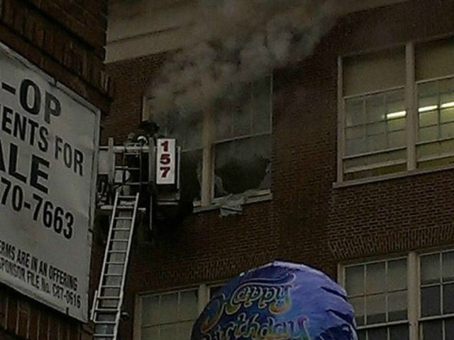 <p>Smoke billows out of Midwood High School on Tuesday November 27, 2012.&nbsp;</p>
