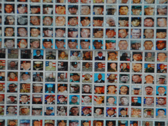 <p>The piece included photos of people who died in the Afghanistan war, the artist said.</p>
