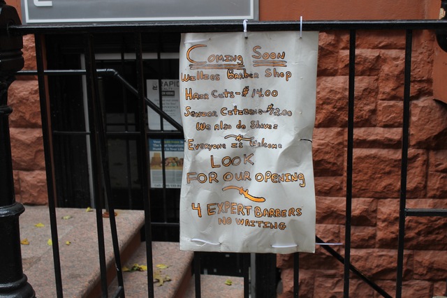 <p>A sign advertising affordable prices outside of Willies Barber Shop.</p>

