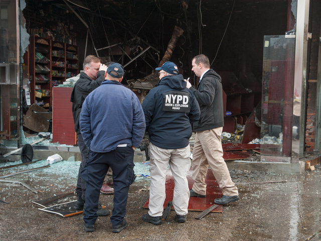 <p>Investigators at the scene of the fire at 587 Franklin Avenue on Monday November 12th, 2012.</p>
